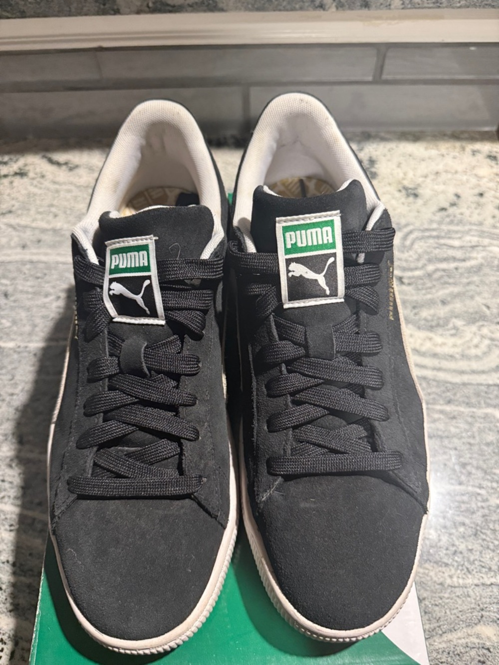 Puma Black Suede Sneakers with White Soles and Green Logo